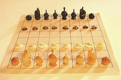the initial array of Thai chessmen, shown with the traditional cowry shells